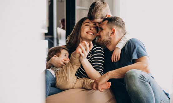 young-family-with-their-sons-home-having-fun-compressed